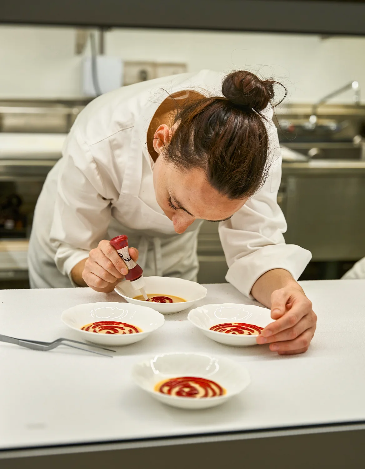 Chef plating in kitchen